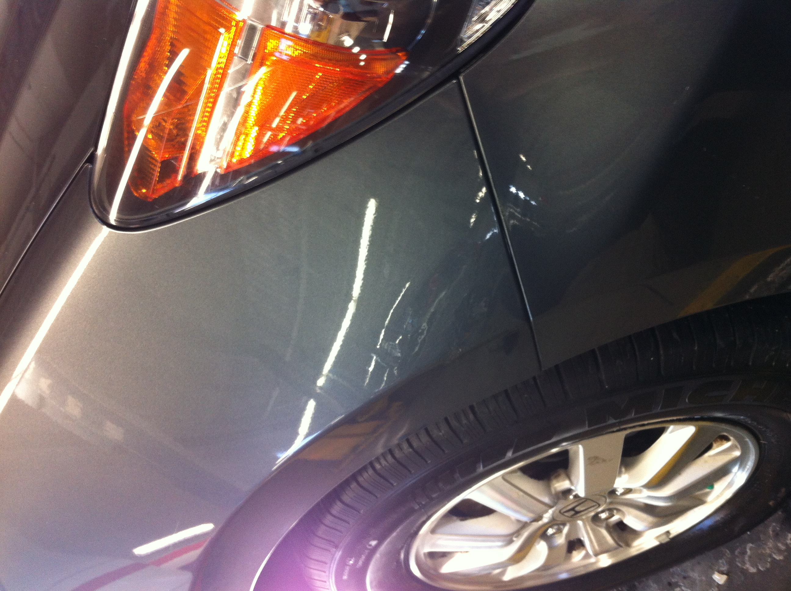 After quarter panel dent near taillight repair